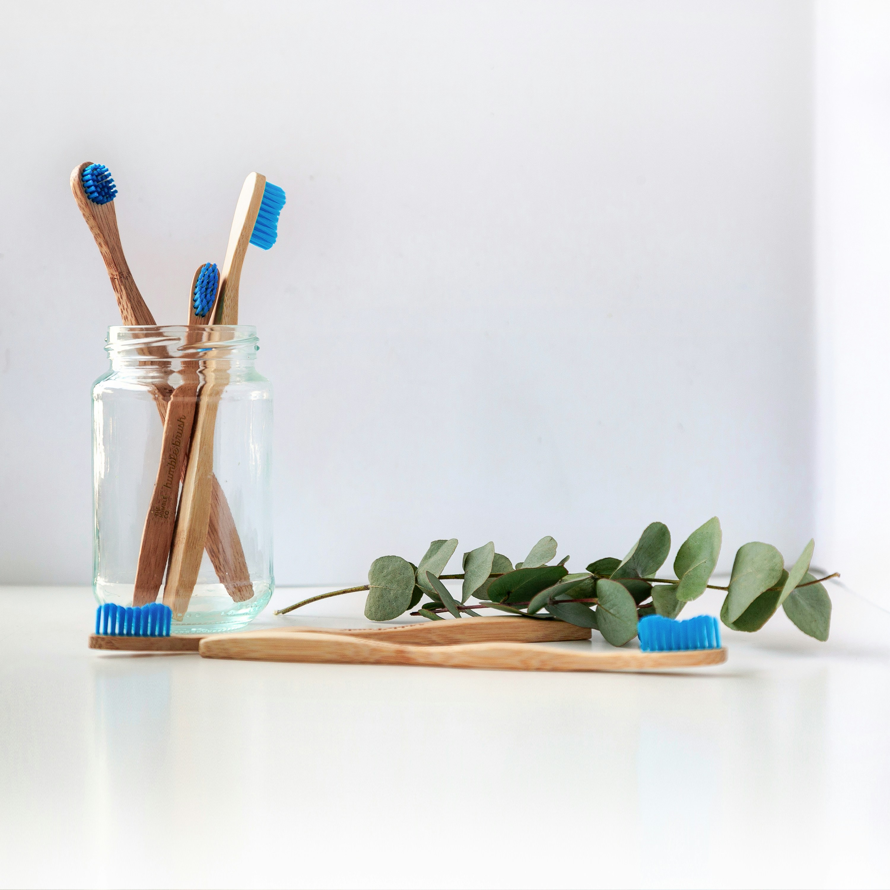 An image of toothbrushes with blue bristles.